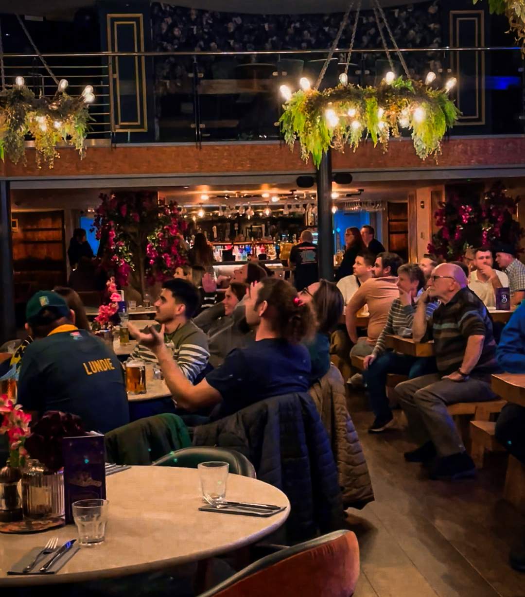 Pub-goers watching Scotland v South Africa Rubgy 2024